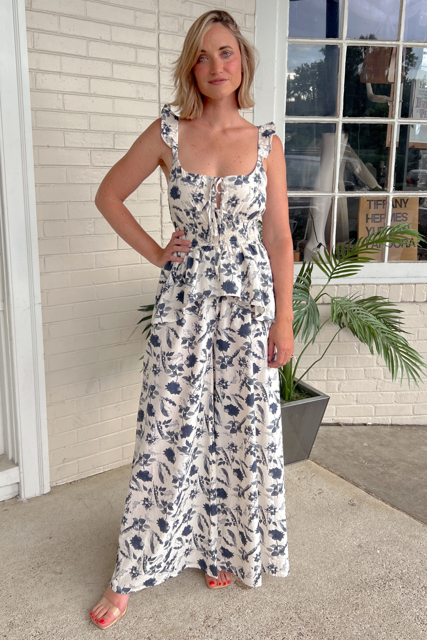 Storia | Navy Floral Ruffle Strap Jumpsuit | Sweetest Stitch Boutique